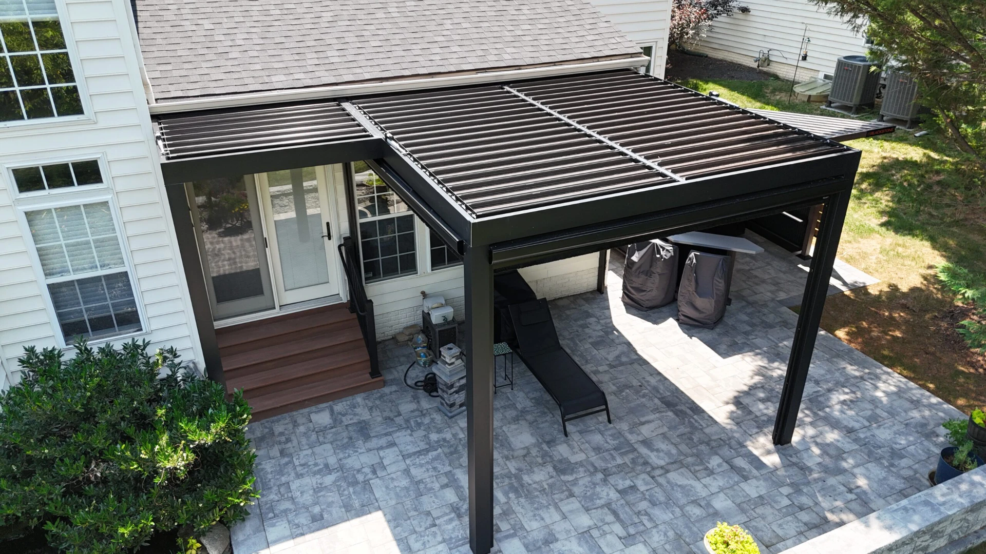 Aerial view of black pergola with furniture