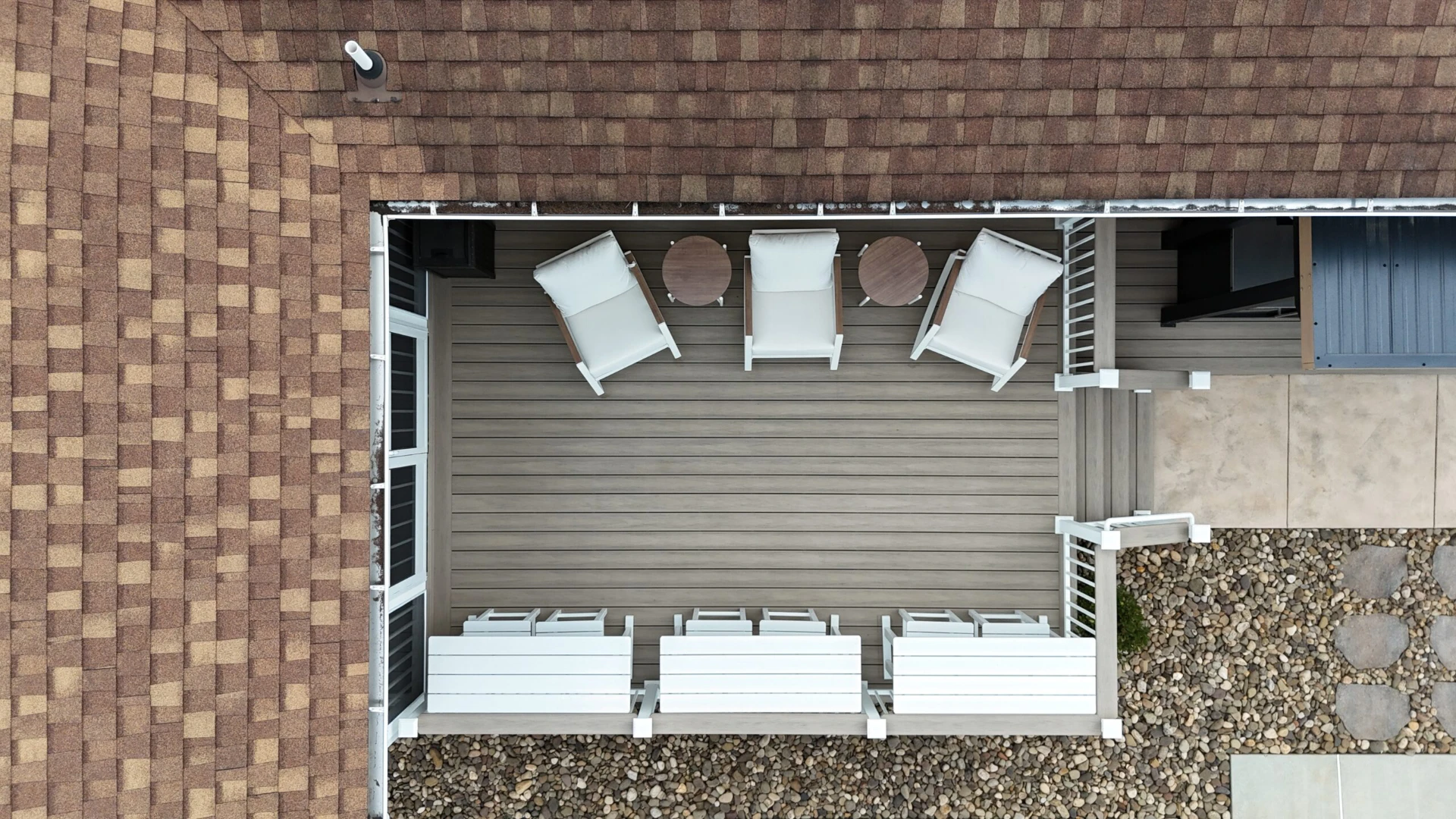 Aerial view of deck installation with outdoor furniture
