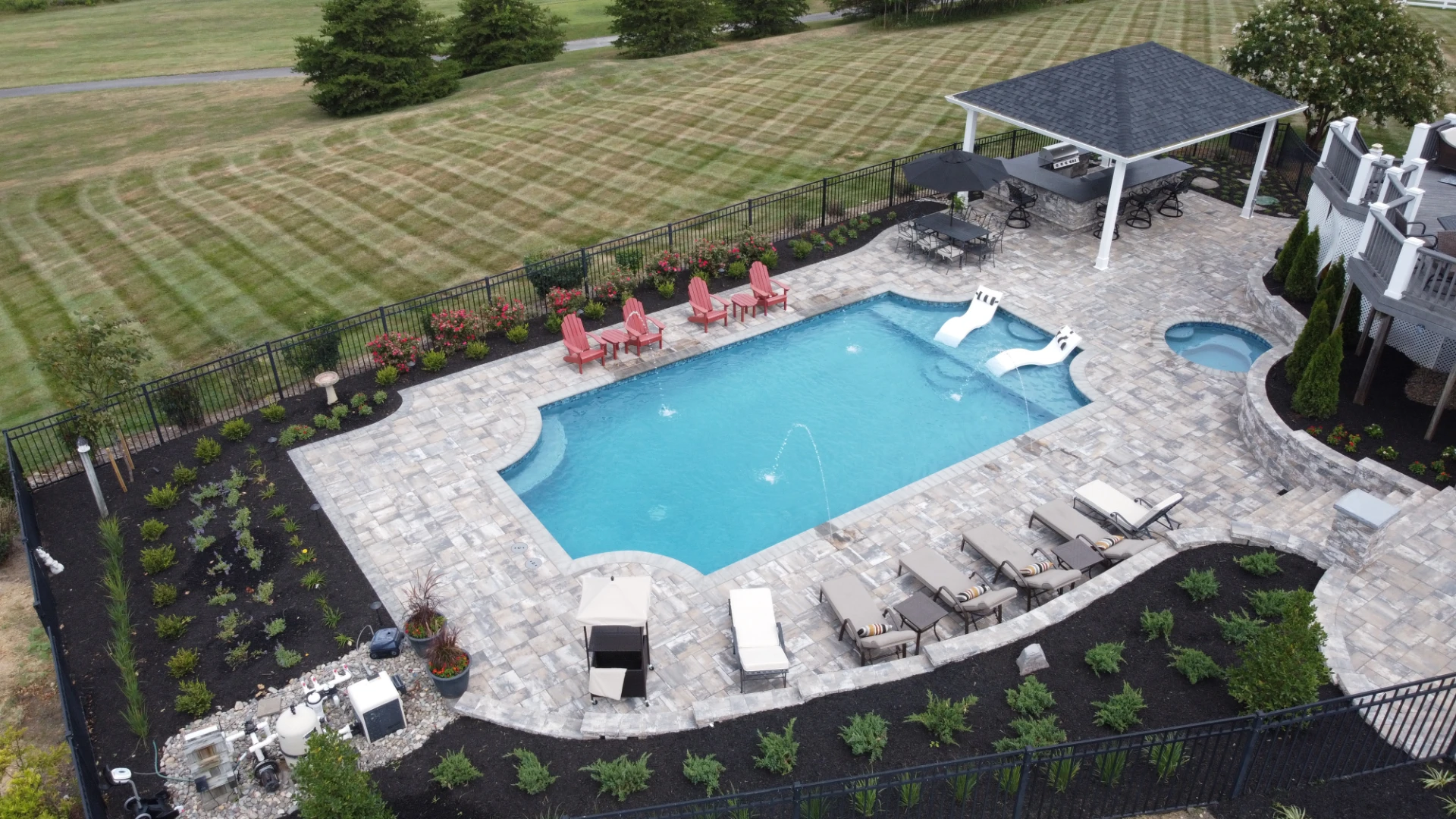 Aerial view of patio builder with black big fence