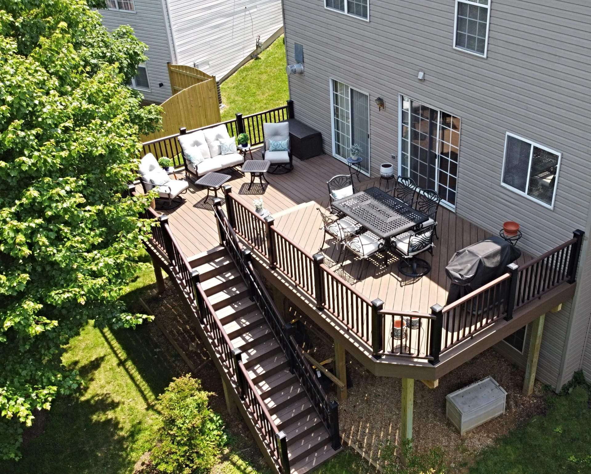 Aerial view of the 3d design and rendering of elevated residential deck with outdoor living furniture