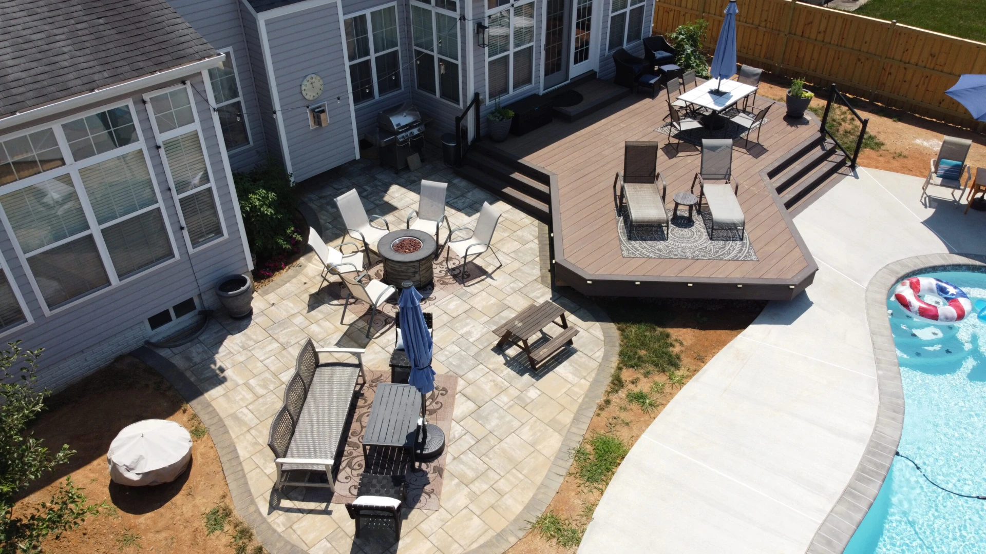 Aerial view of the patio builder with outdoor living fire pit featuring custom hard deck