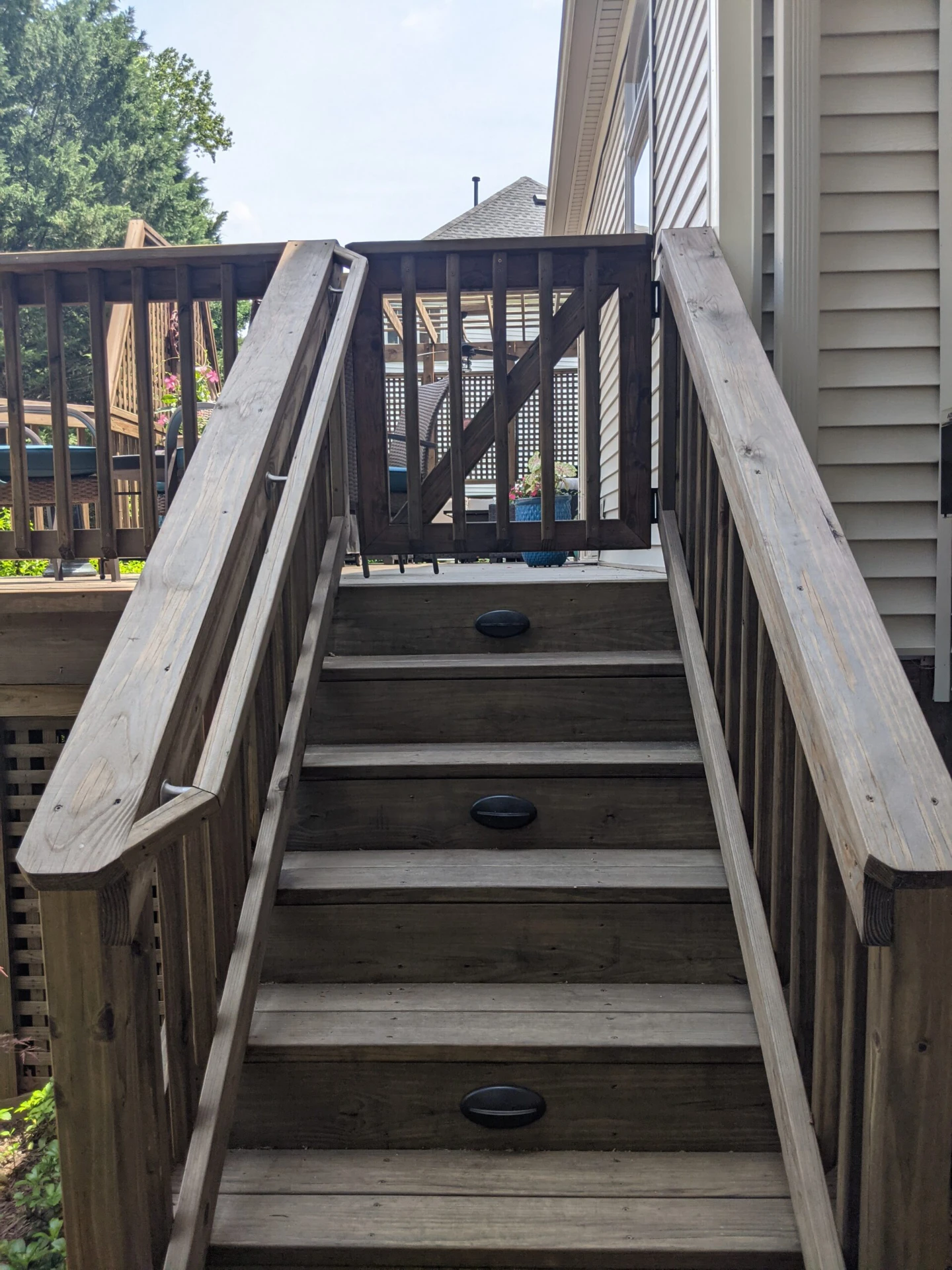 Bamboo deck with lighting and a small entrance door