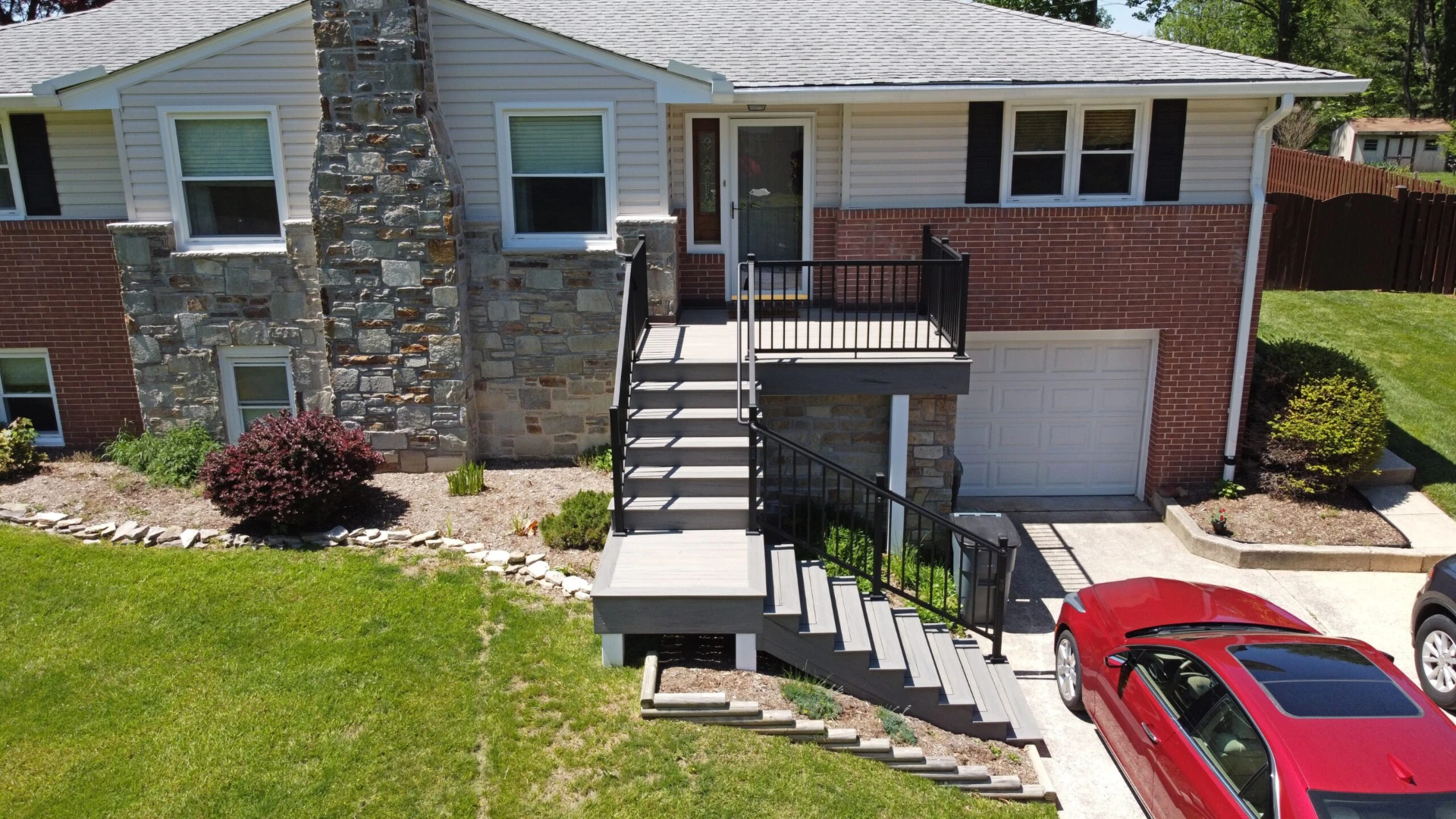 Carports with long stairs and black railing