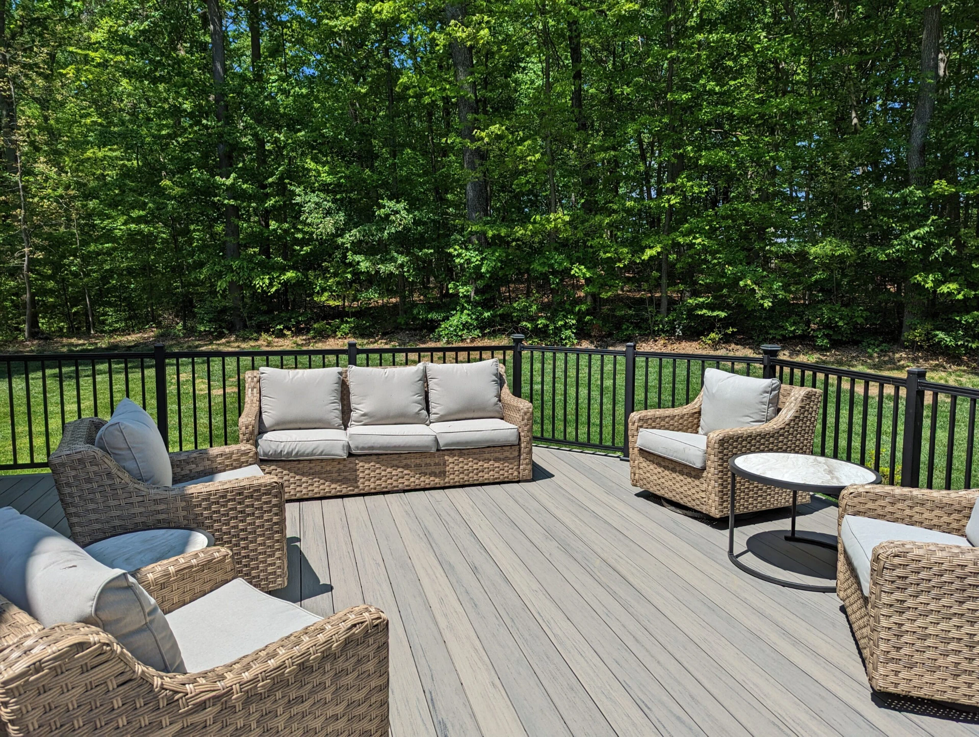 Commercial decking with furniture and overlooking forest view