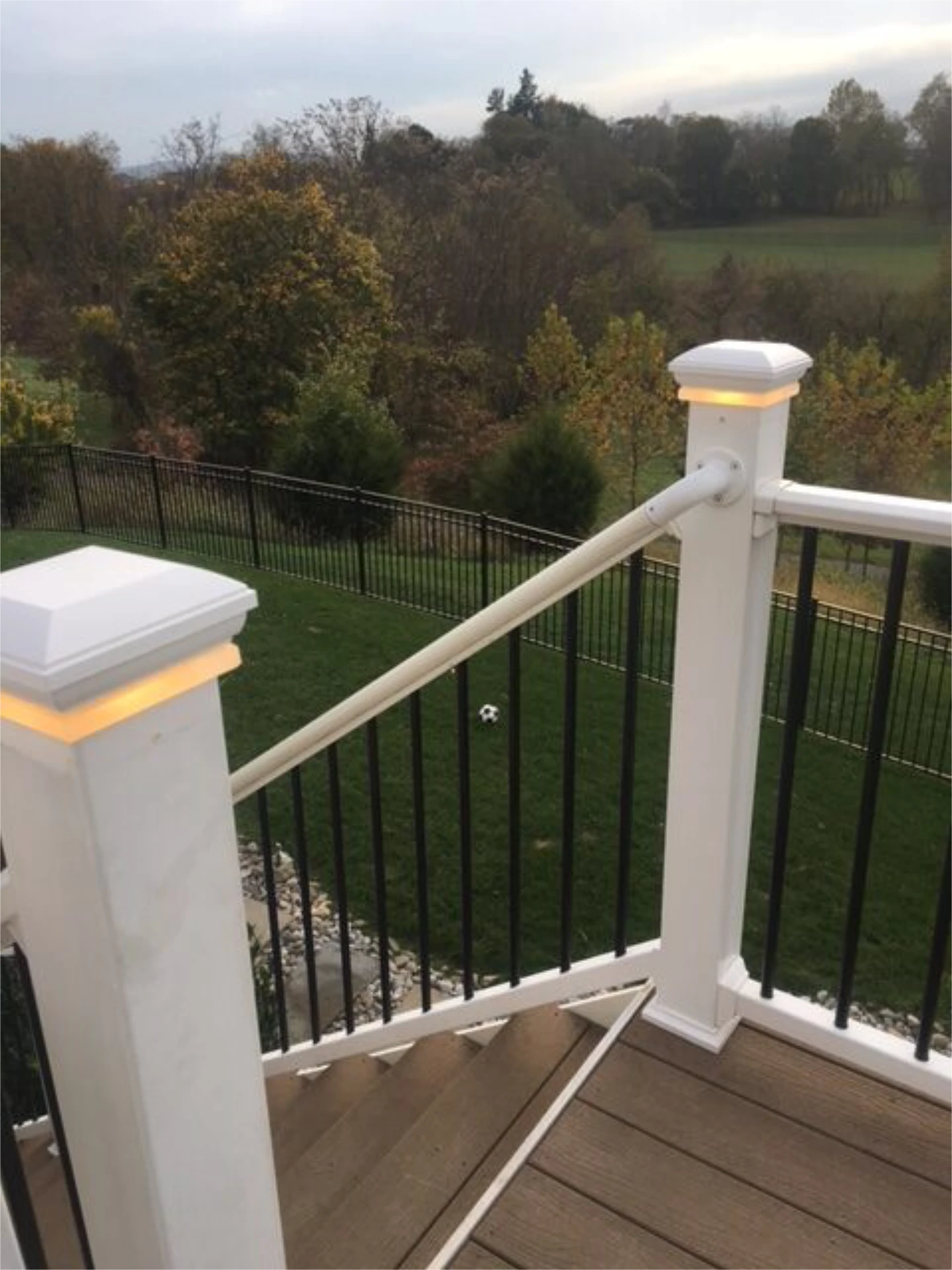 Deck railing with lights and big metal fence