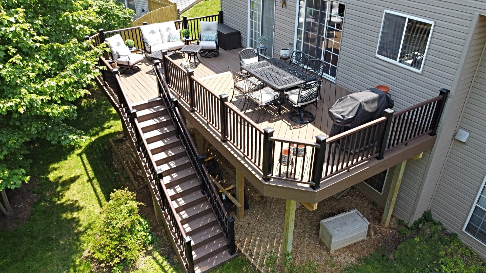 Elevated commercial decking with wooden railing and a lot of furniture