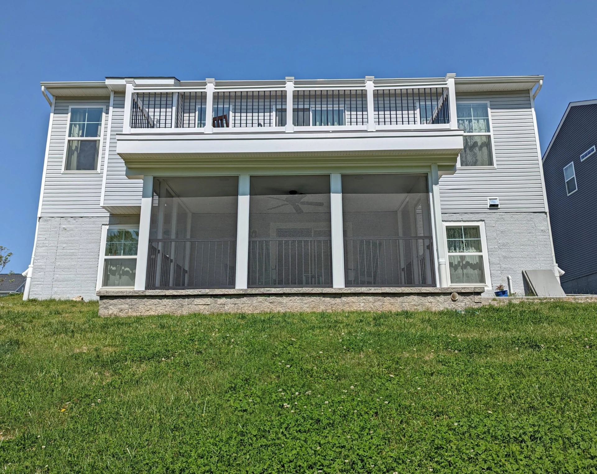 Elevated deck with privacy screened porch on the bottom