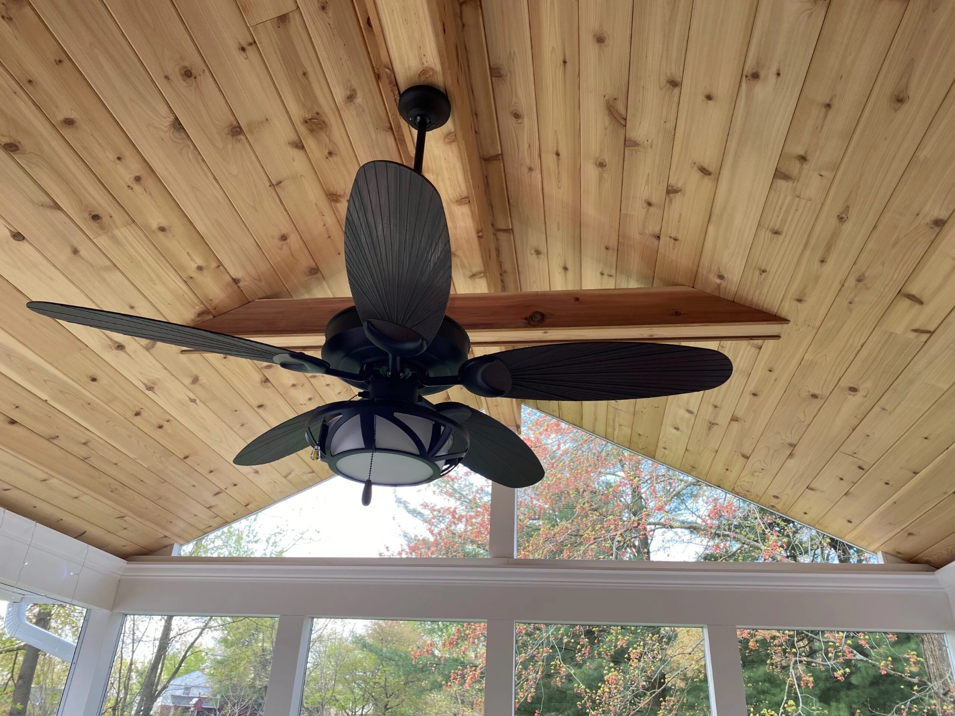 Exhaust fan on the wood ceiling inside the porch