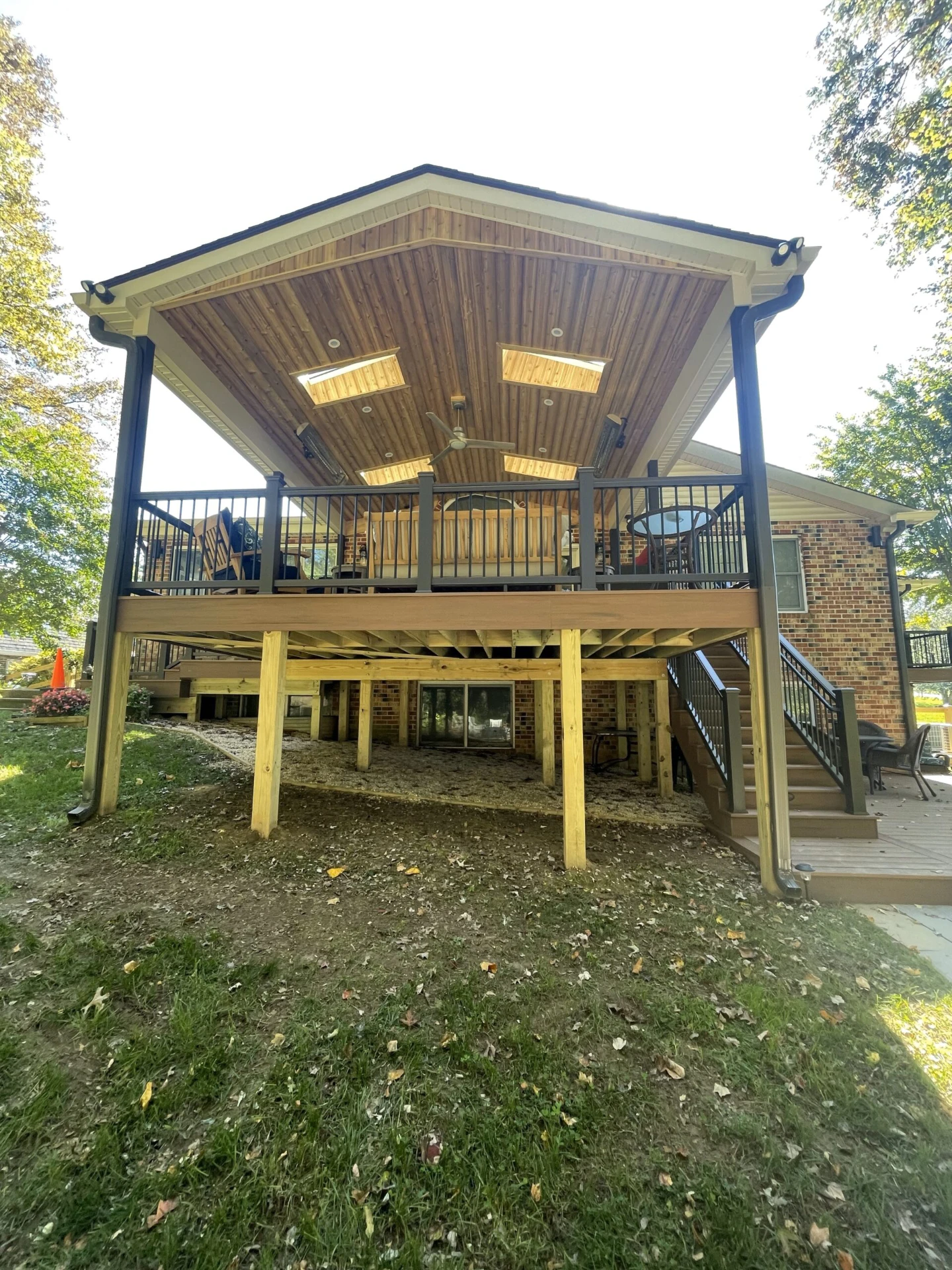 Front view of the elevated deck framing with black railing