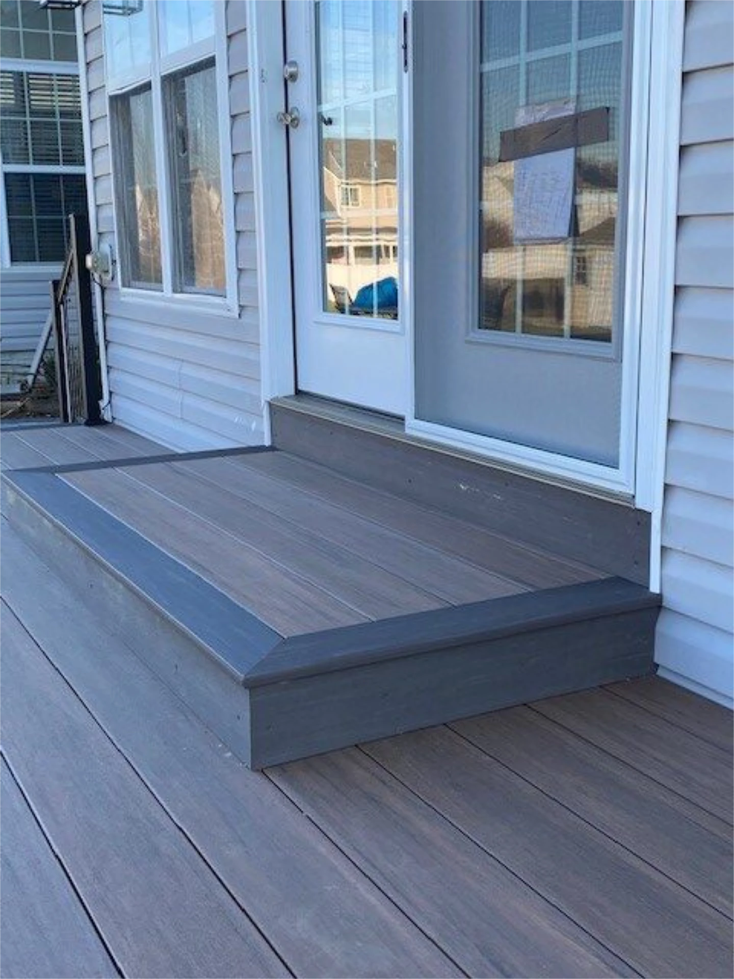 Hard wood deck and glass window door