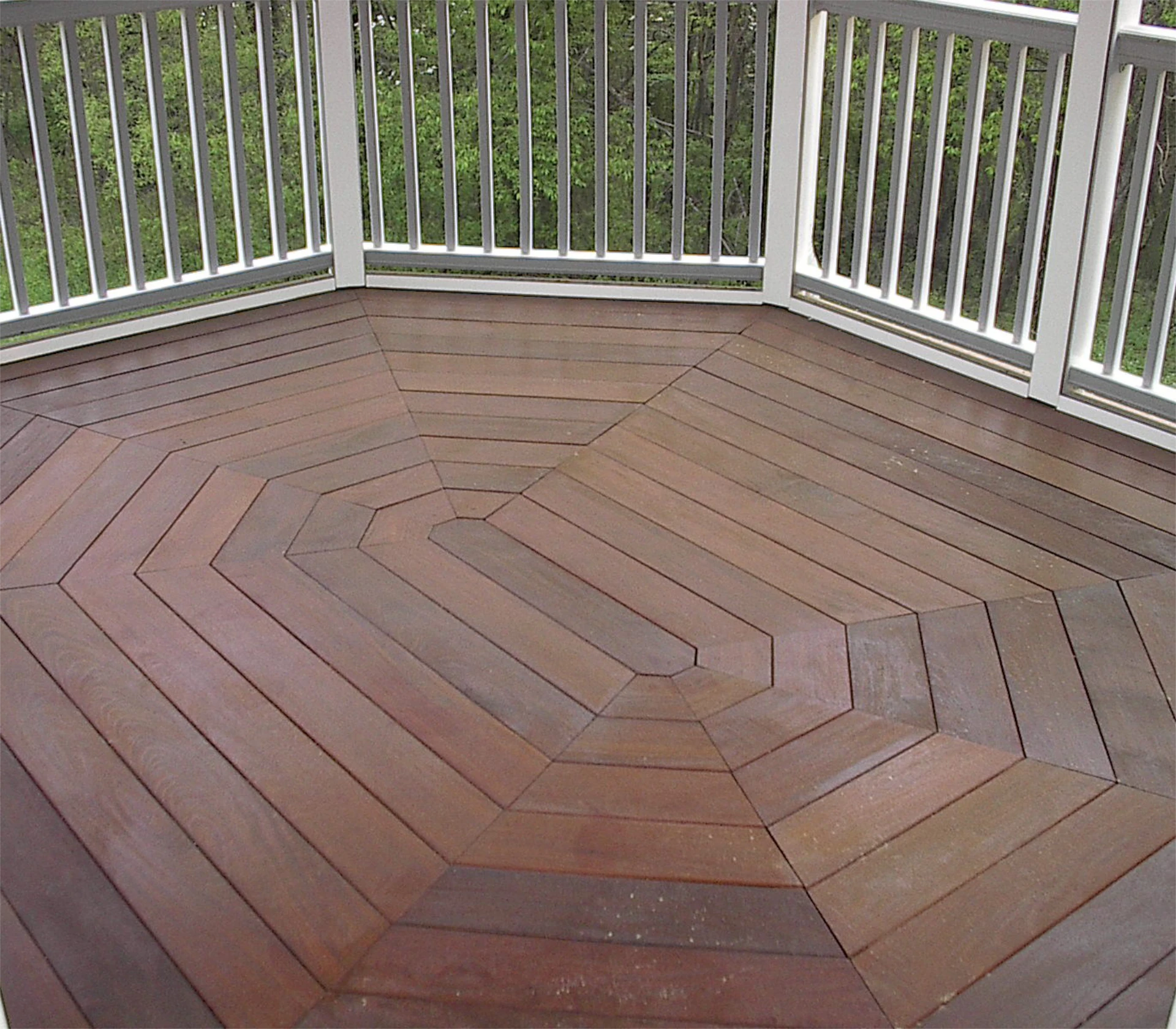 Hard wood deck design and consultation with white railing
