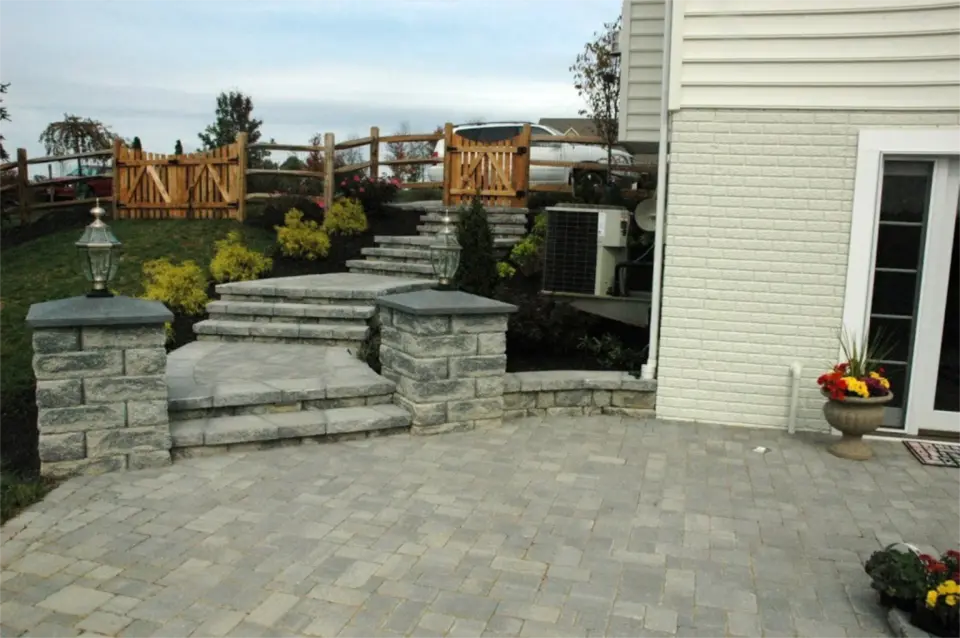 Imgi 4 Block and paver steps down to paver patio with lit columns in Frederick MD.