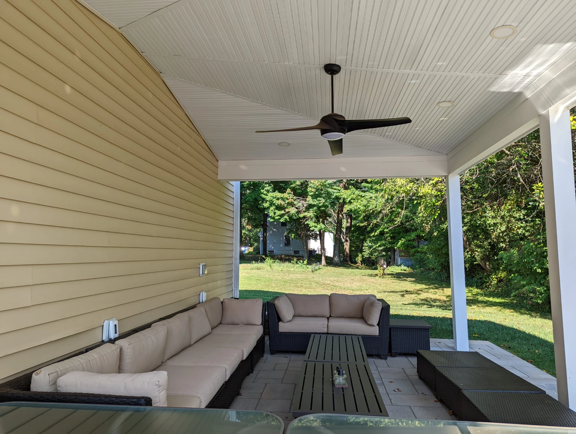 Open porch with ceiling with fan and nature scenery