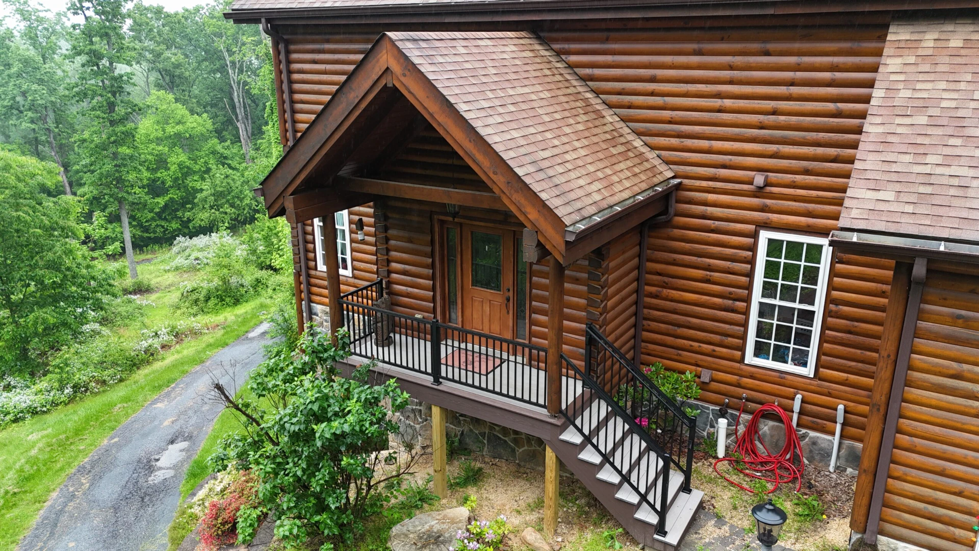 Raised deck with black deck railing with bronze porticos