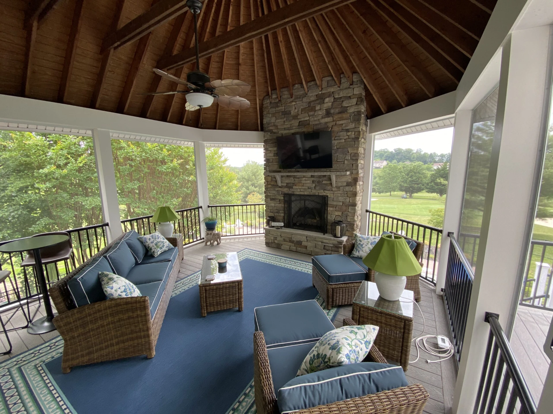 Screened porch with coastline decking and overlooking nature scenery outside