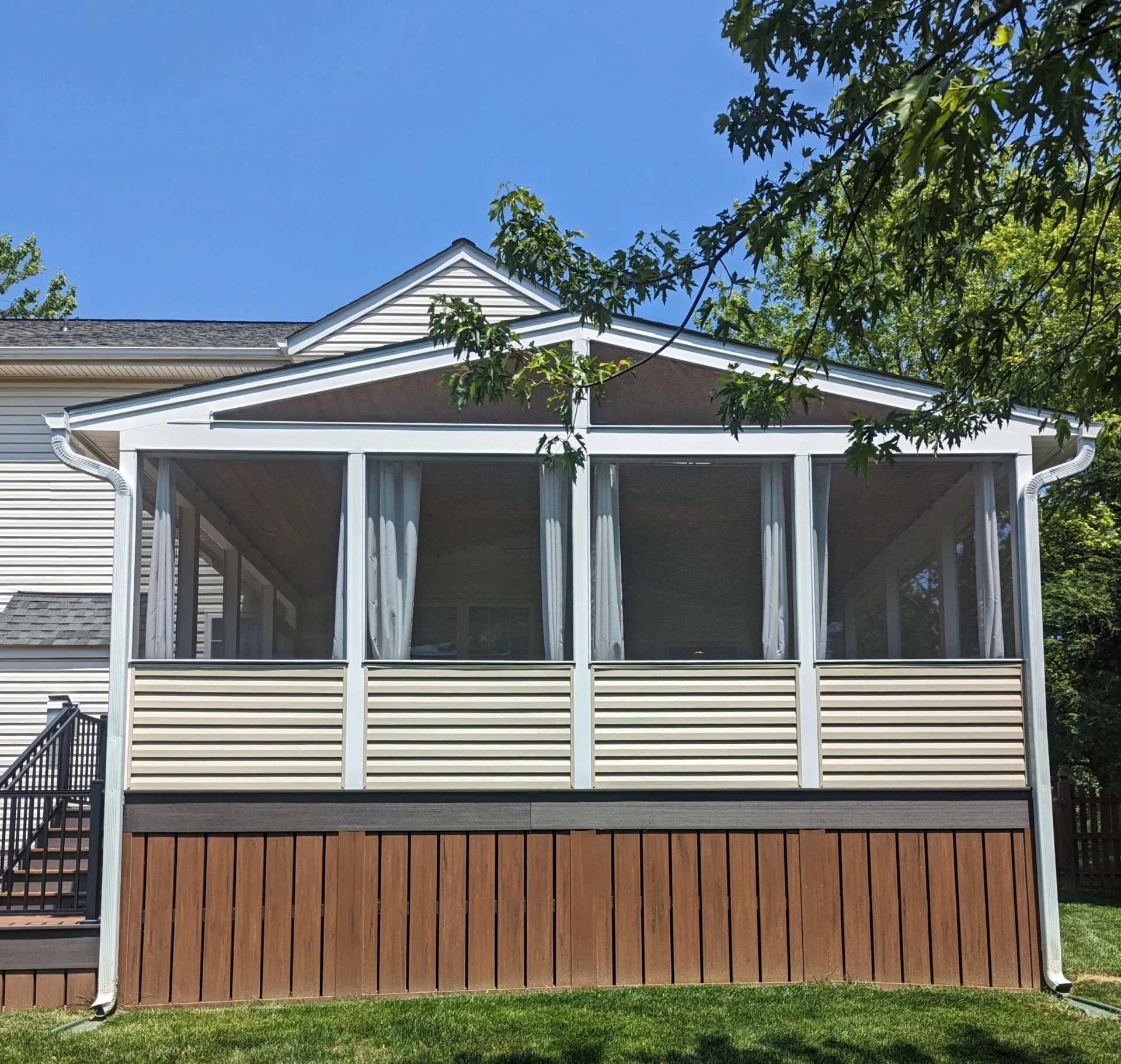 Screened porch with mahogany skirting with overlooking view