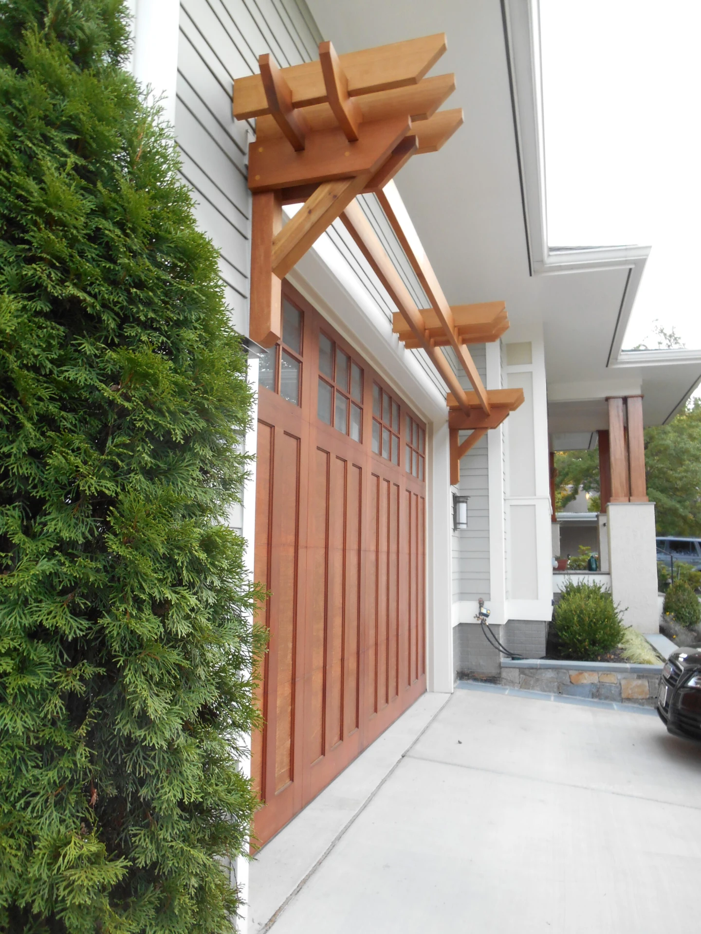 Side view of the pergola installation with big wooden door