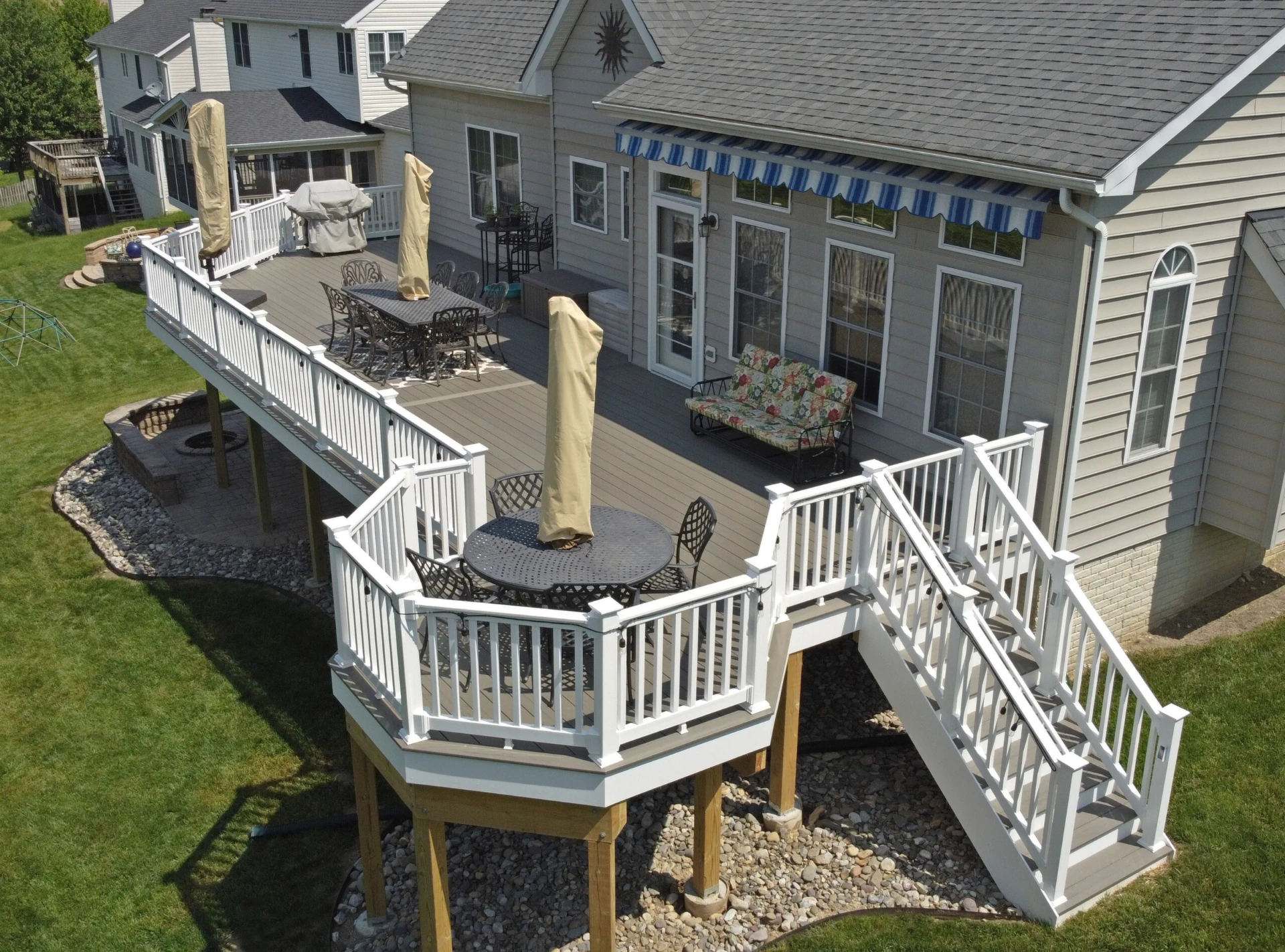 Sun kissed elevated residential deck with washington vinyl rail
