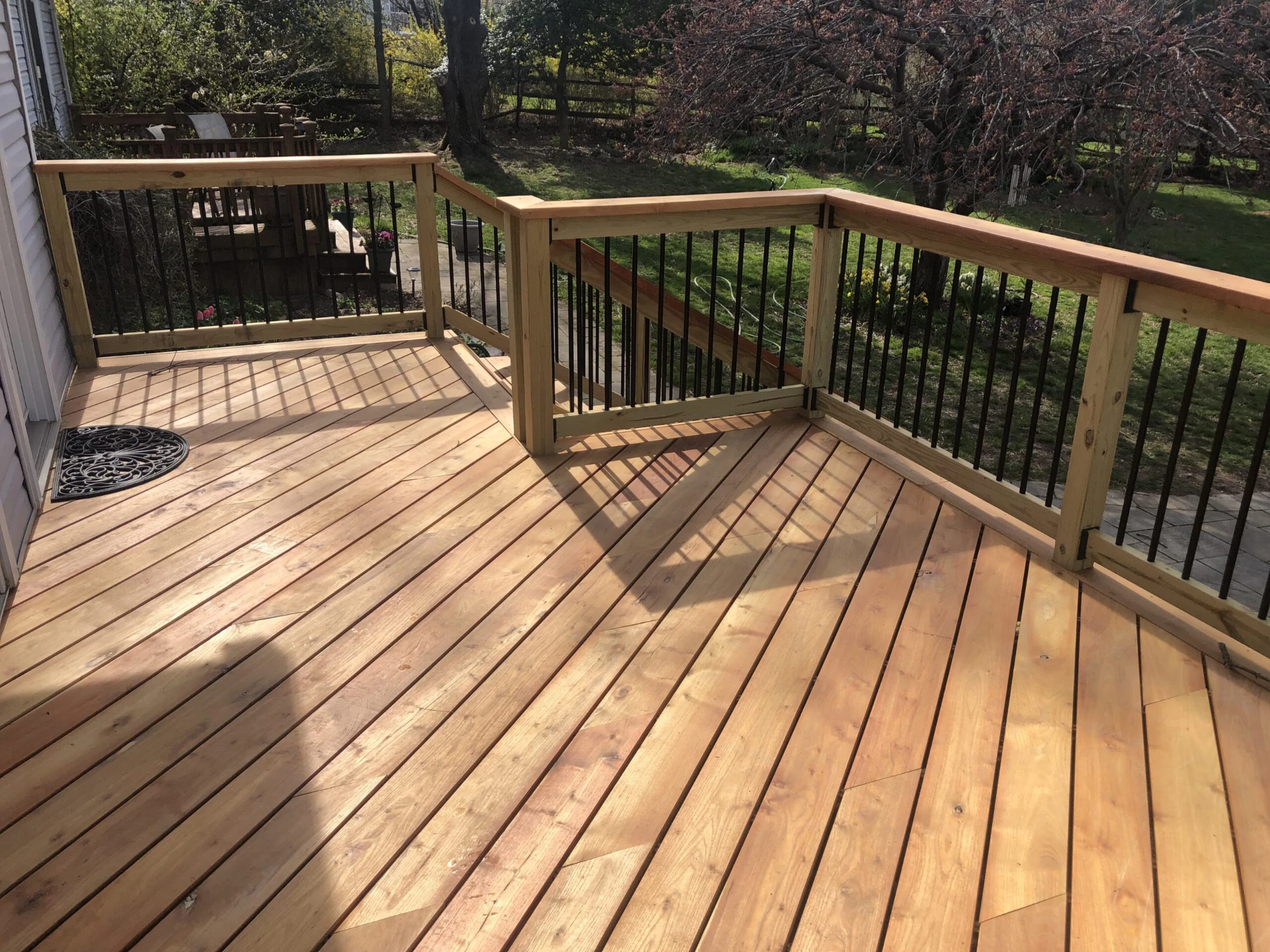 Sun kissed hard wood deck with nature scenery